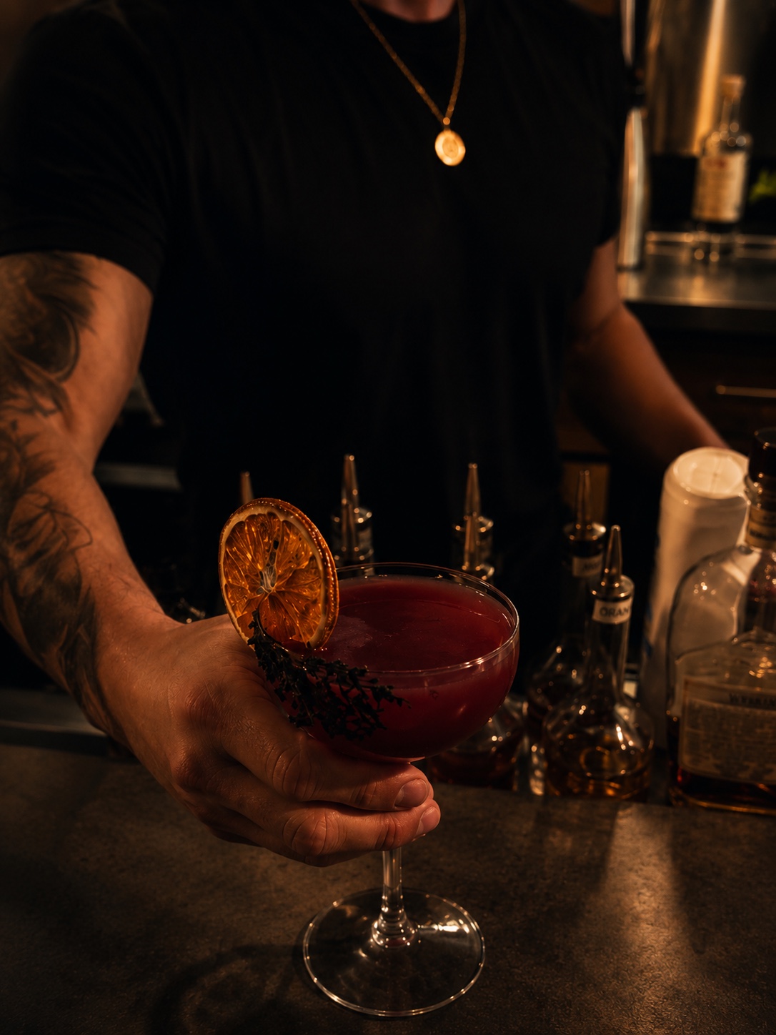 Julian preparing craft cocktails at a luxury event